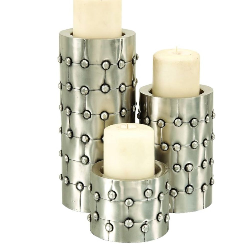Set of three candleholders (candles not included).  See all pics.  Firm price.